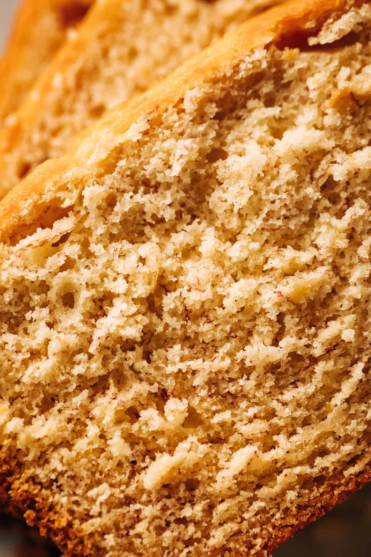 A close up image of a fluffy banana cake crumb