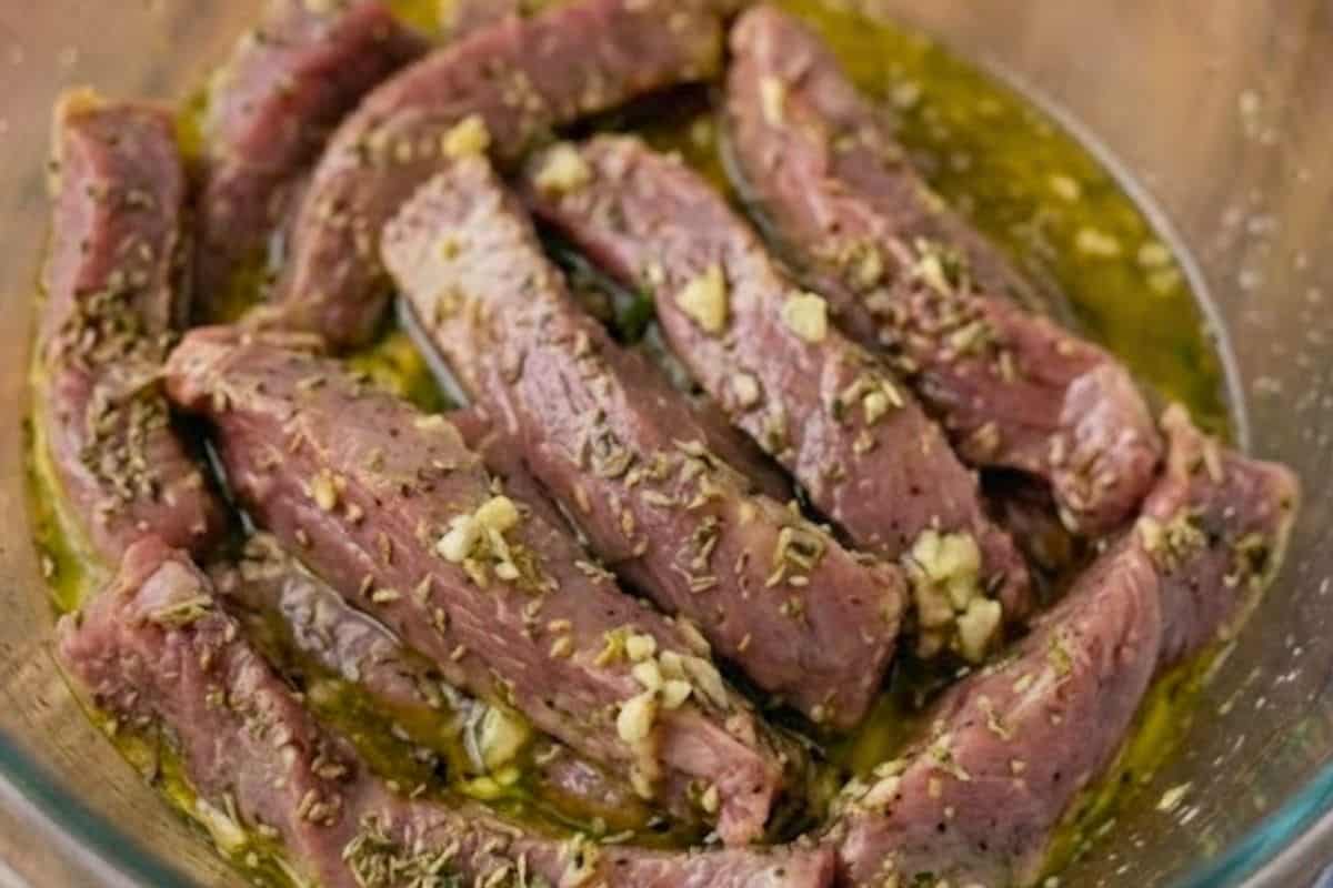 Combine garlic oil, lemon juice, garlic, thyme, parsley, oregano, and stock powder. Add lamb