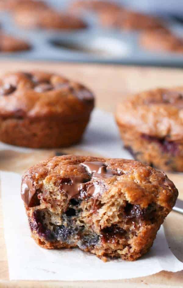 A bite taken from Banana and Blueberry Chocolate Chip Muffins