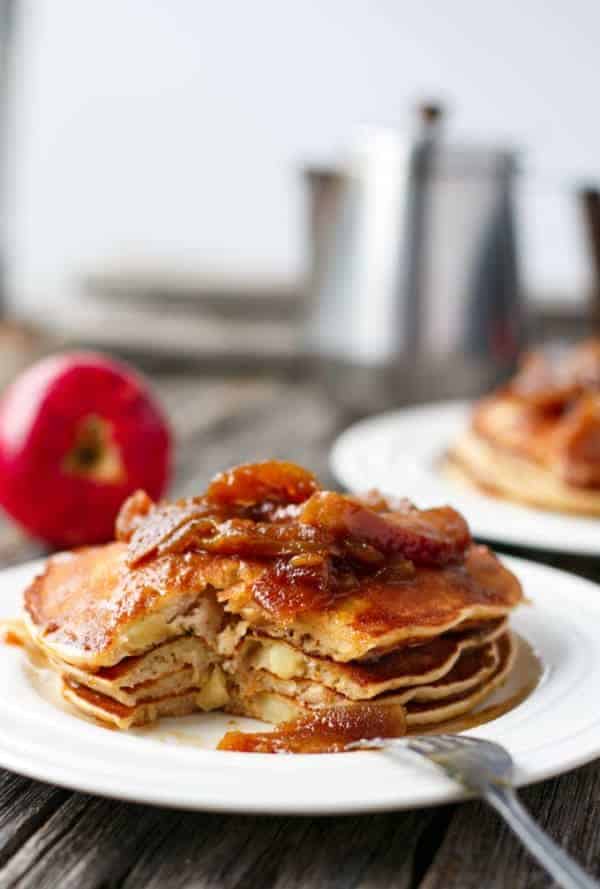 A piece being taken from Caramel Apple Pancakes