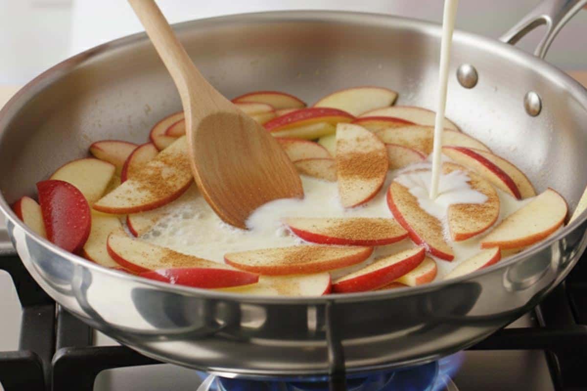 Pouring the milk in the pan.
