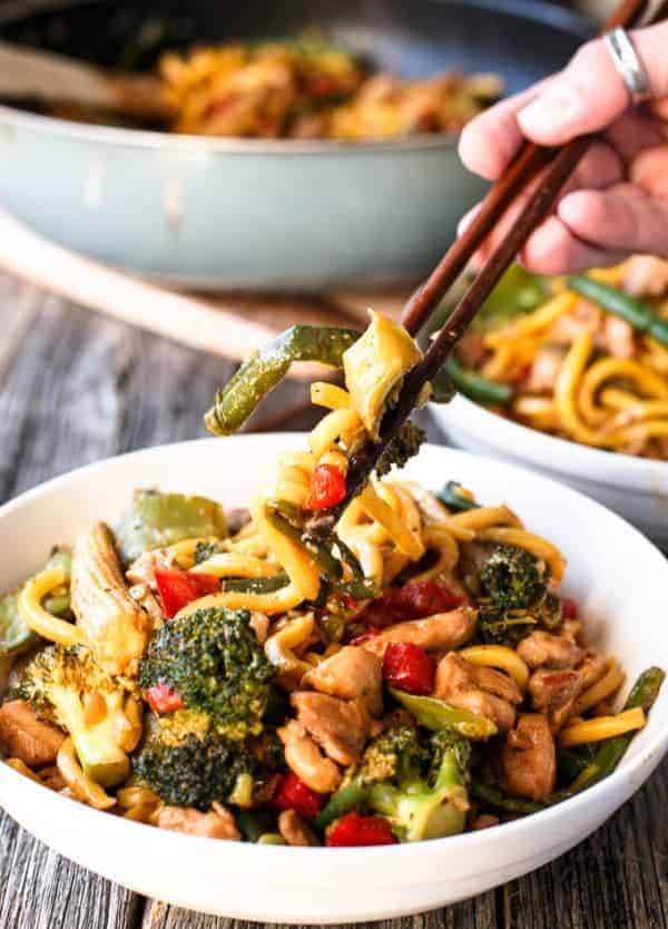 Chicken Noodle Stirfry being pulled by chopsticks