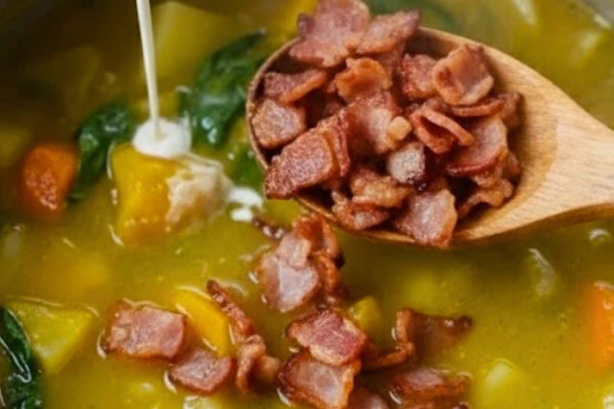 Once the vegetables are tender, pour the cream into the pot and add the cooked bacon.