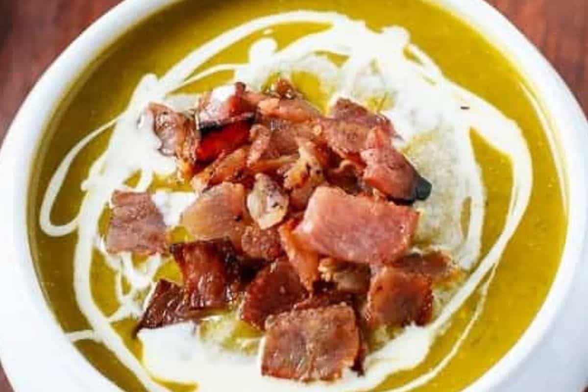 Ladle the soup into bowls, drizzle with extra cream, and top with the remaining bacon