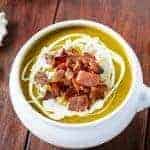 Creamy Pumpkin and Spinach Soup with Crispy Bacon in a bowl