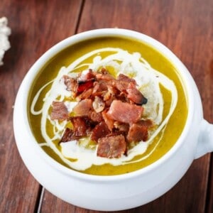 Creamy Pumpkin and Spinach Soup with Crispy Bacon in a bowl