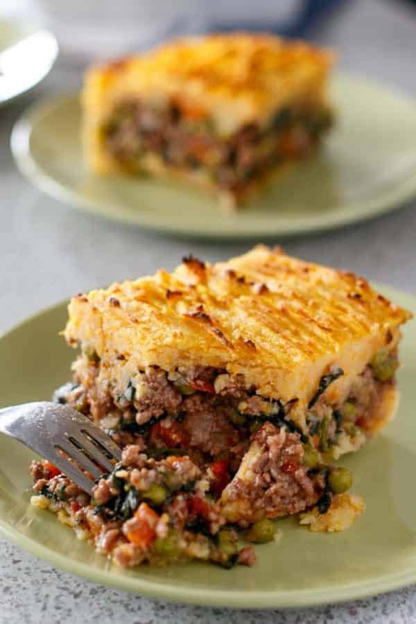 Fork piercing on a piece taken from Beef and Pumpkin Shepards Pie