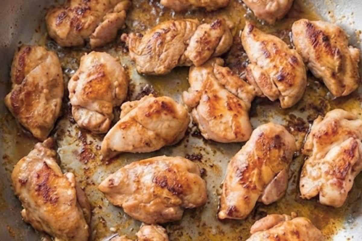 Heat a large frying pan over medium heat and cook the marinated chicken until golden and cooked through
