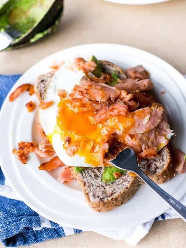 Crispy Smoked Salmon and Fried Egg Stack on a plate with fork