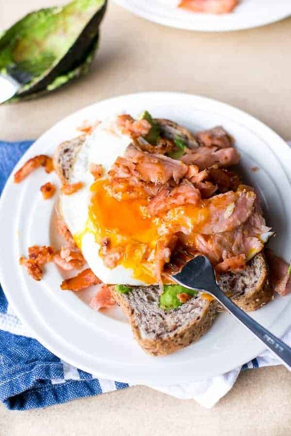 Crispy Smoked Salmon and Fried Egg Stack on a plate with fork