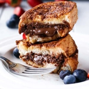 Nutella Stuffed Churro French Toast stack on each other