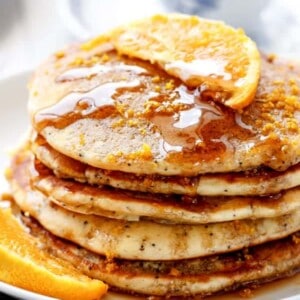 Orange Poppyseed Pancakes being stack on each other
