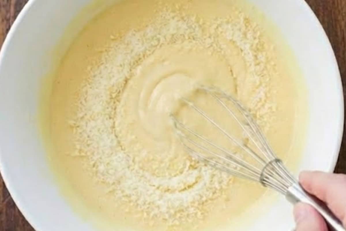 Whisk the cream cheese and eggs in a large bowl until completely smooth and stir in the parmesan, and set aside.