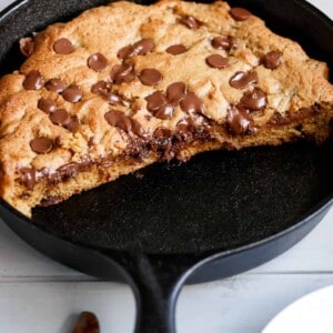 The best buttery and gooey Nutella stuffed deep dish chocolate chip skillet cookie