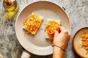 Preparing the grilled cheese sandwiches