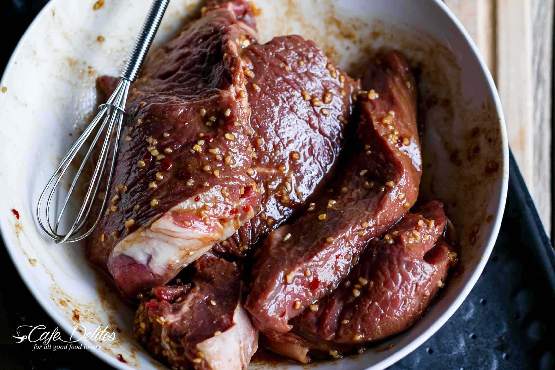 Raw marinated Steak in a bowl