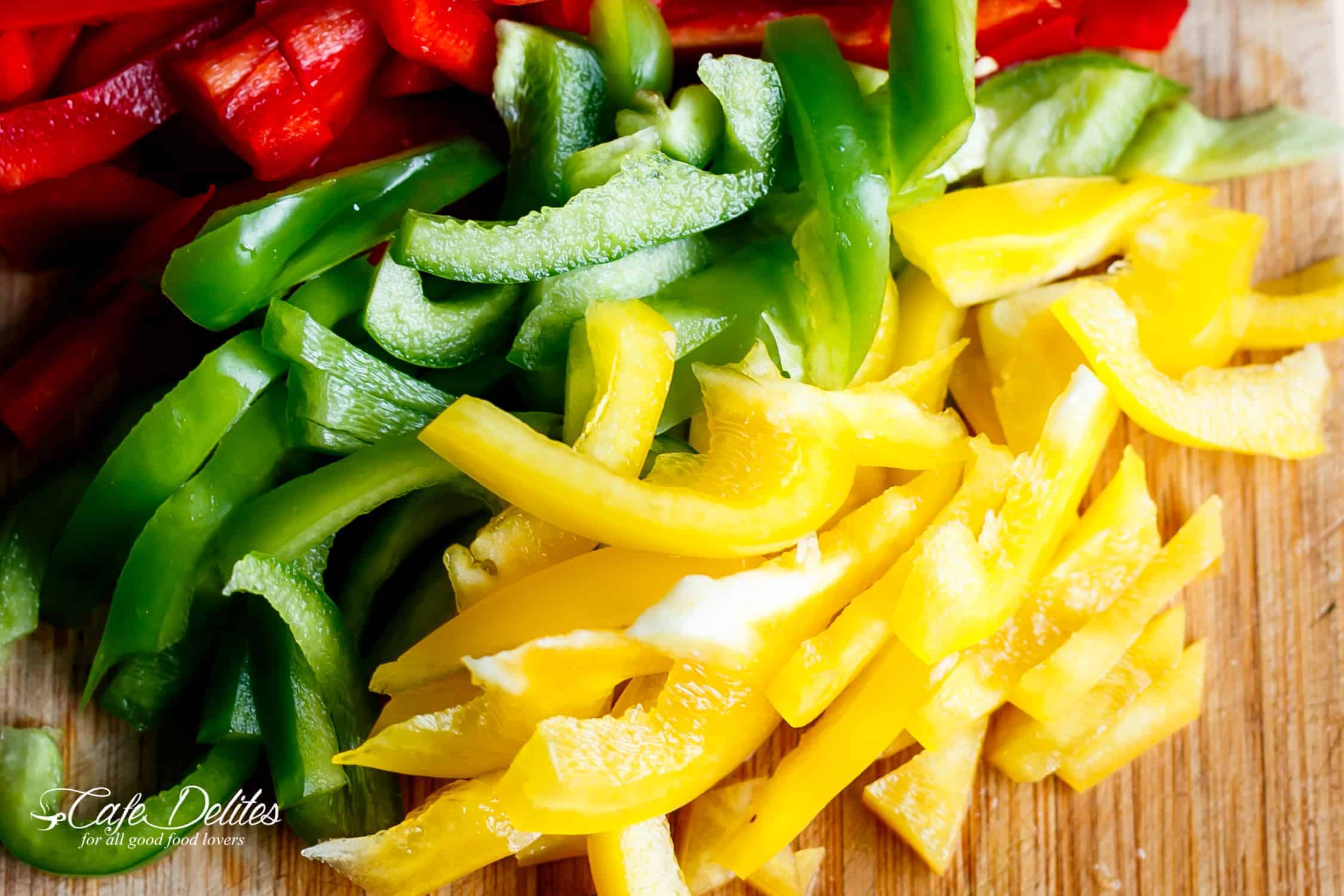 Slices of red, yellow and green bell peppers