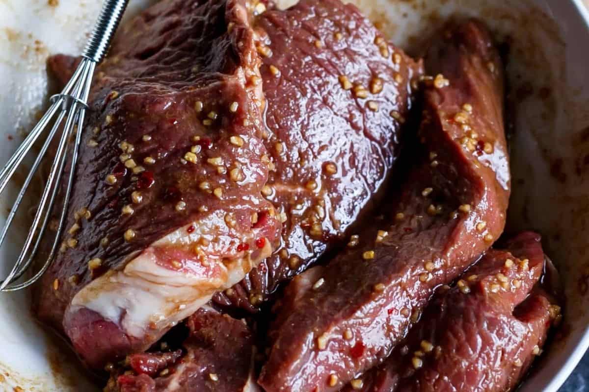Pour half of the marinade over the beef fillets and turn to coat