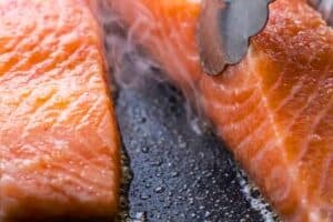 Salmon being cooked in hot oil