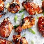 Sticky Honey Sesame Chicken Wings on a baking tray