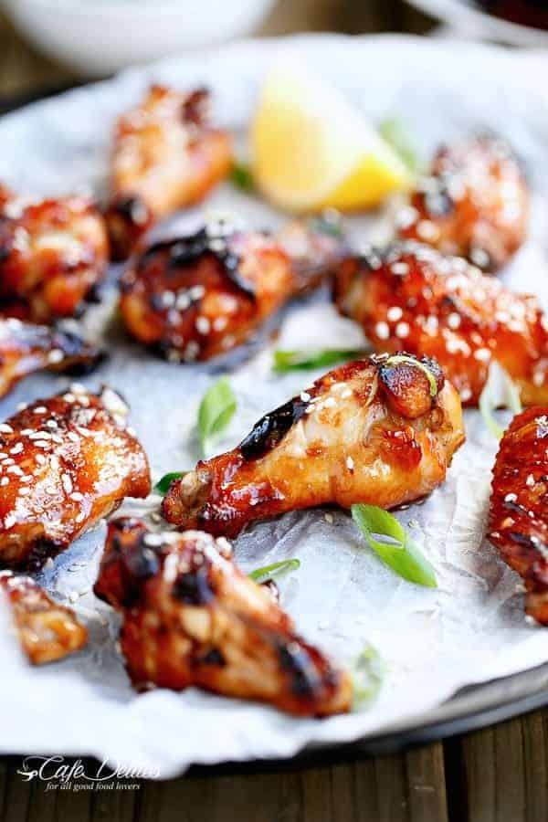 Sticky Honey Sesame Chicken Wings on a butter paper