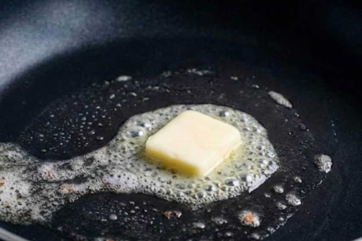 Preheat a large nonstick pan or skillet with a light coating of butter over medium heat