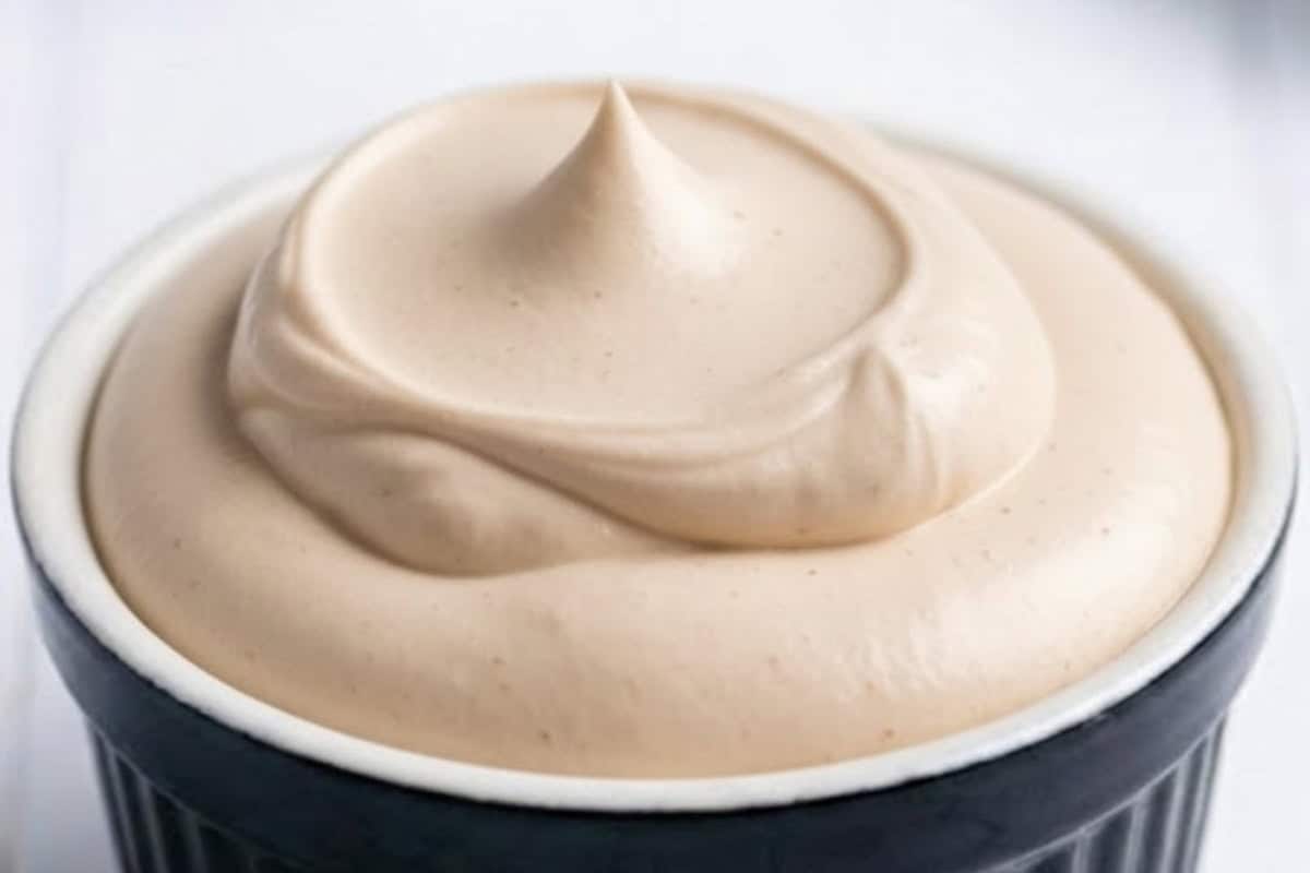 In a bowl, combine cream, sugar, and instant coffee.