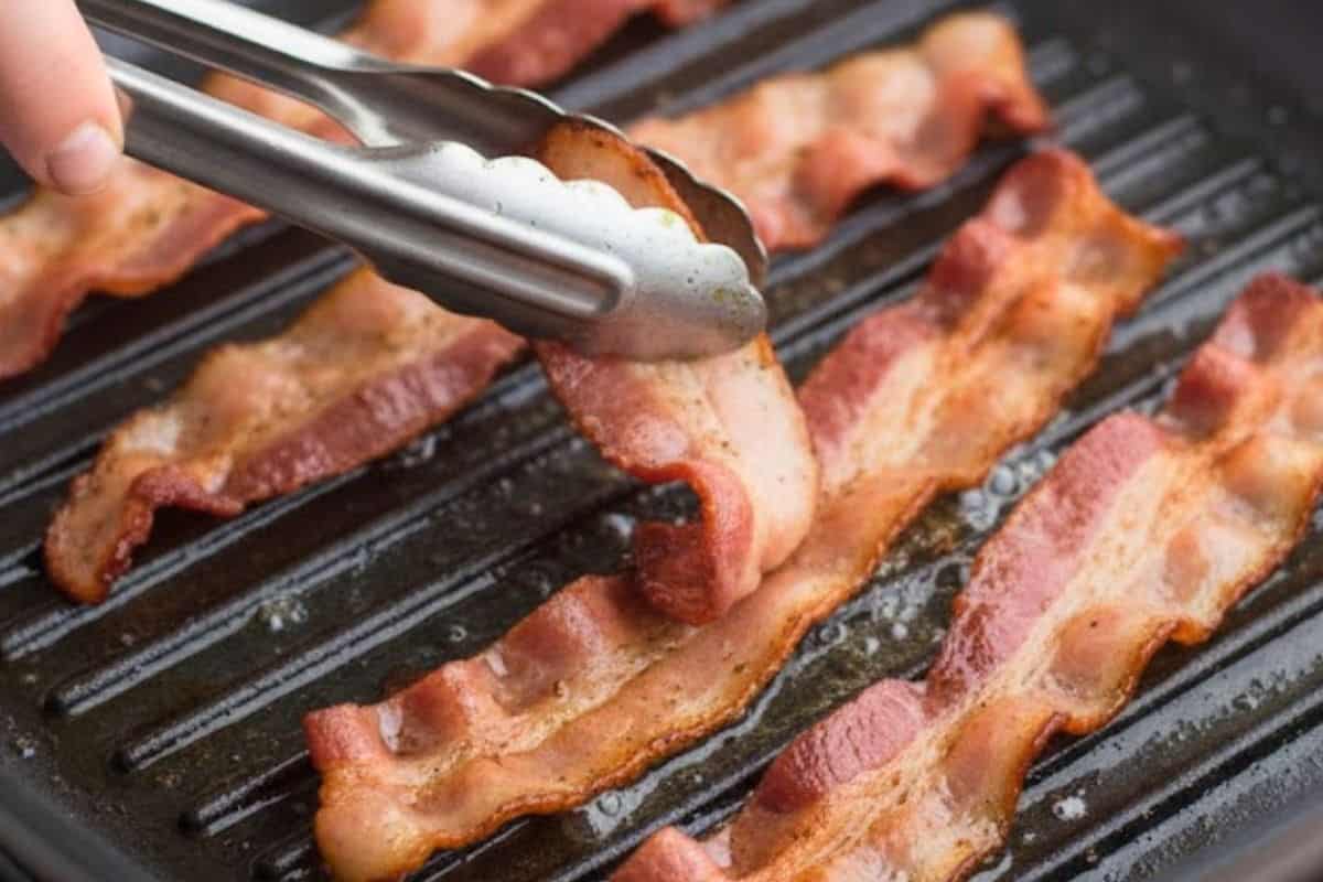 In the same pan, add the bacon strips and fry until golden and crispy