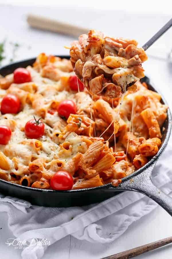 Delicious Cheesy Chicken and Roasted Tomato Mozzarella Pasta Bake in a pan