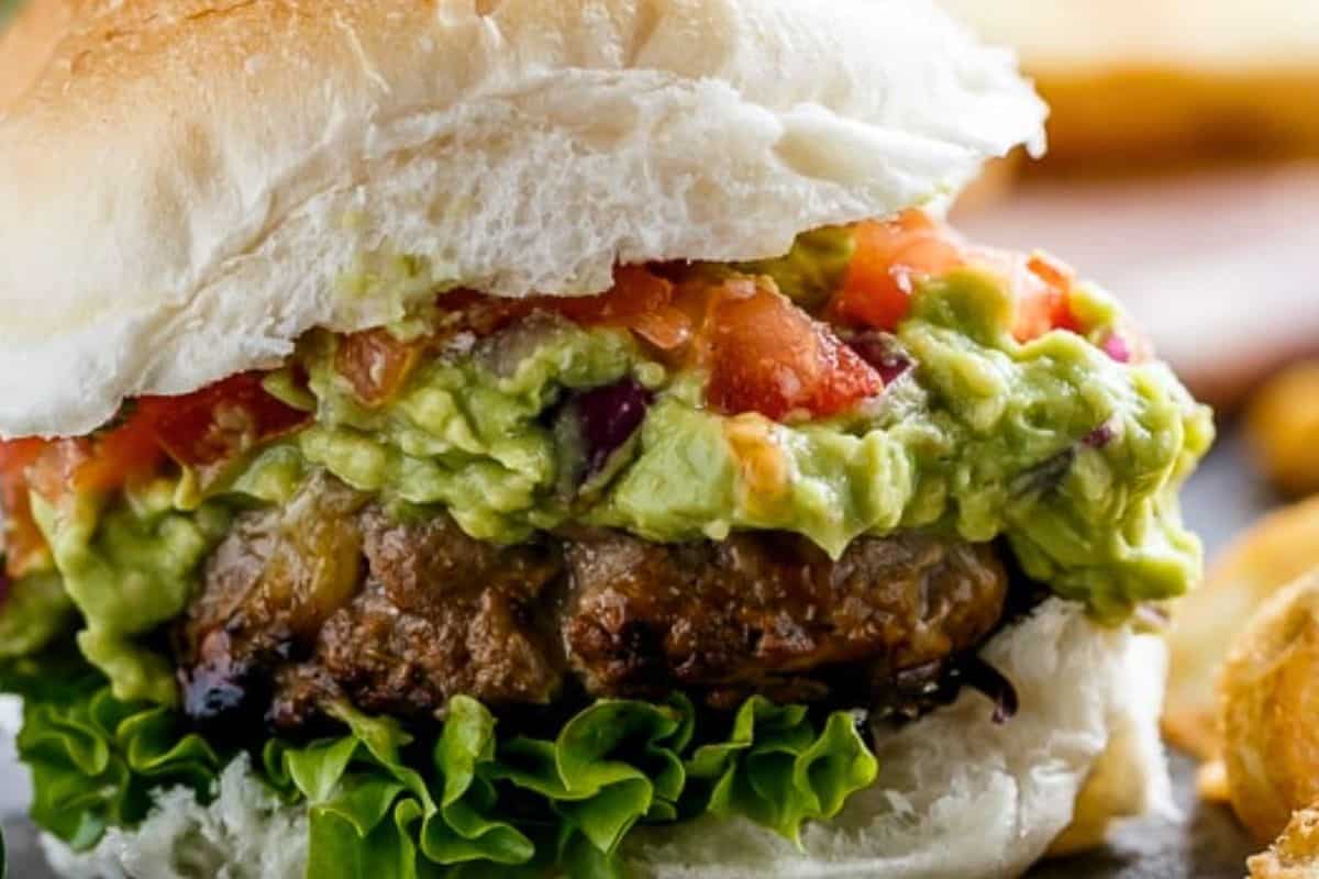 Layer lettuce (if using), beef patties, guacamole, and pico de gallo on your rolls