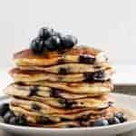 Blueberry Ricotta Pancakes stack on each other