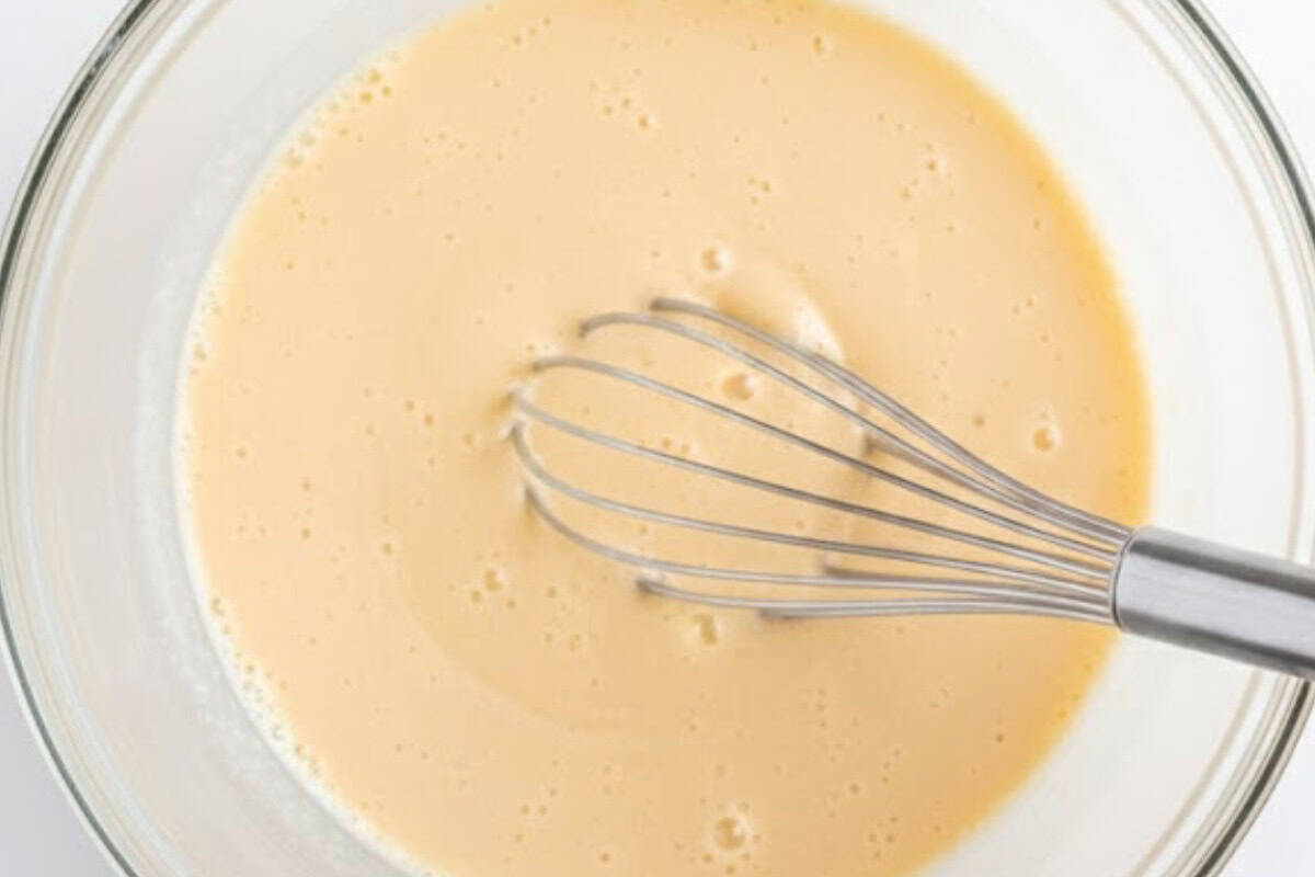 In a large bowl, whisk together the eggs, ricotta, lemon juice, vanilla extract, and milk