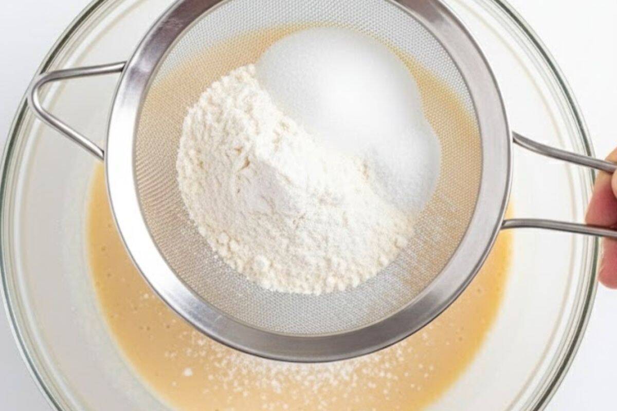 Sift in the self-raising flour, sweetener or sugar, baking powder, and salt.