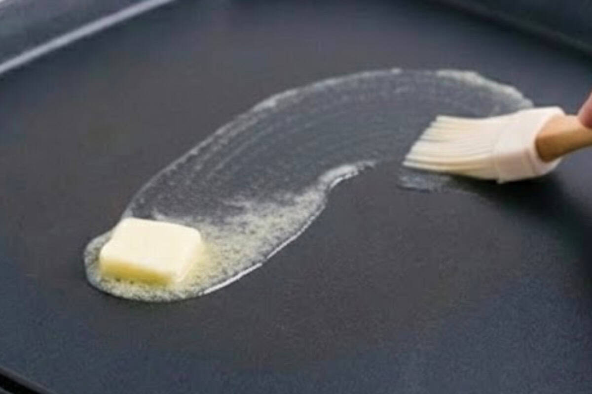 Place a nonstick pan or skillet over low to medium heat and lightly grease with butter or oil
