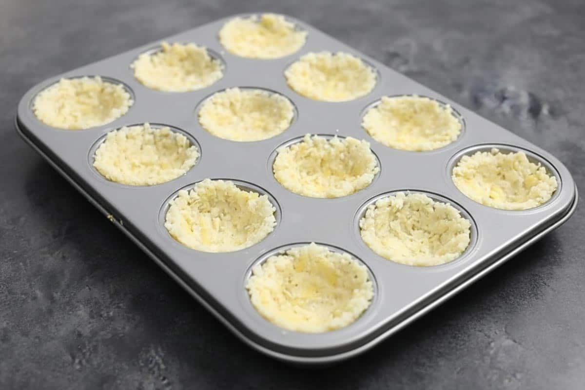 Divided the mixture evenly between the muffin holes.