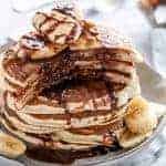 Nutella Stuffed Banana Pancakes stack on each other on a plate