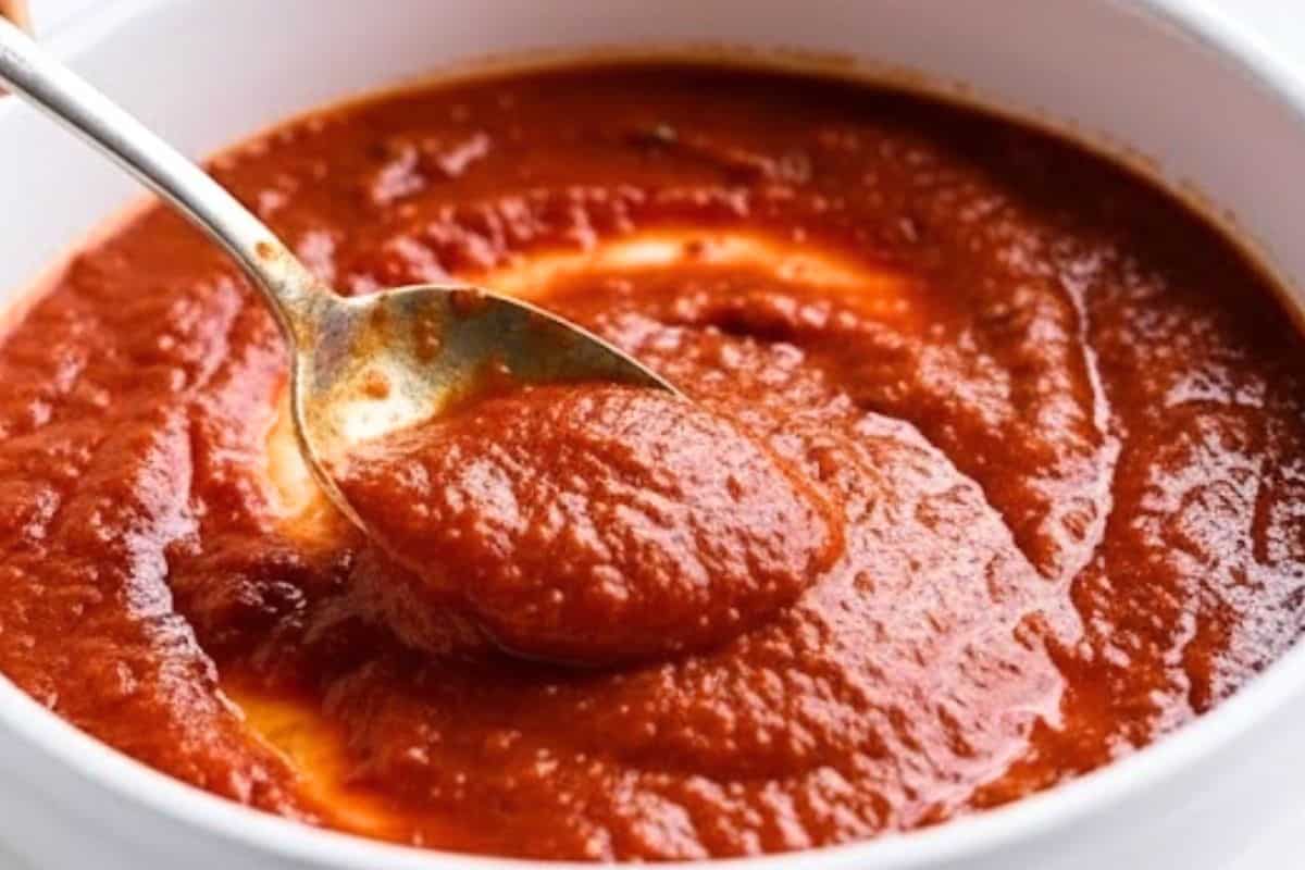 Preheat the oven to 210°C | 410°F and lightly grease a shallow baking dish. Spread half of the pasta sauce evenly over the base of the dish