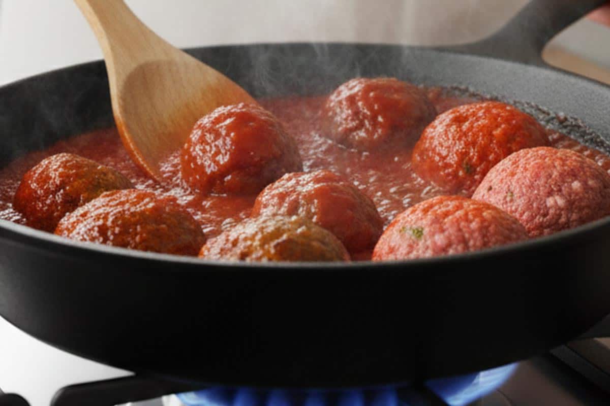 Returned the meatballs to the sauce.
