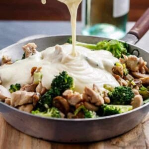 Chicken and Mushrooms in a Creamy White Wine Sauce in a pan