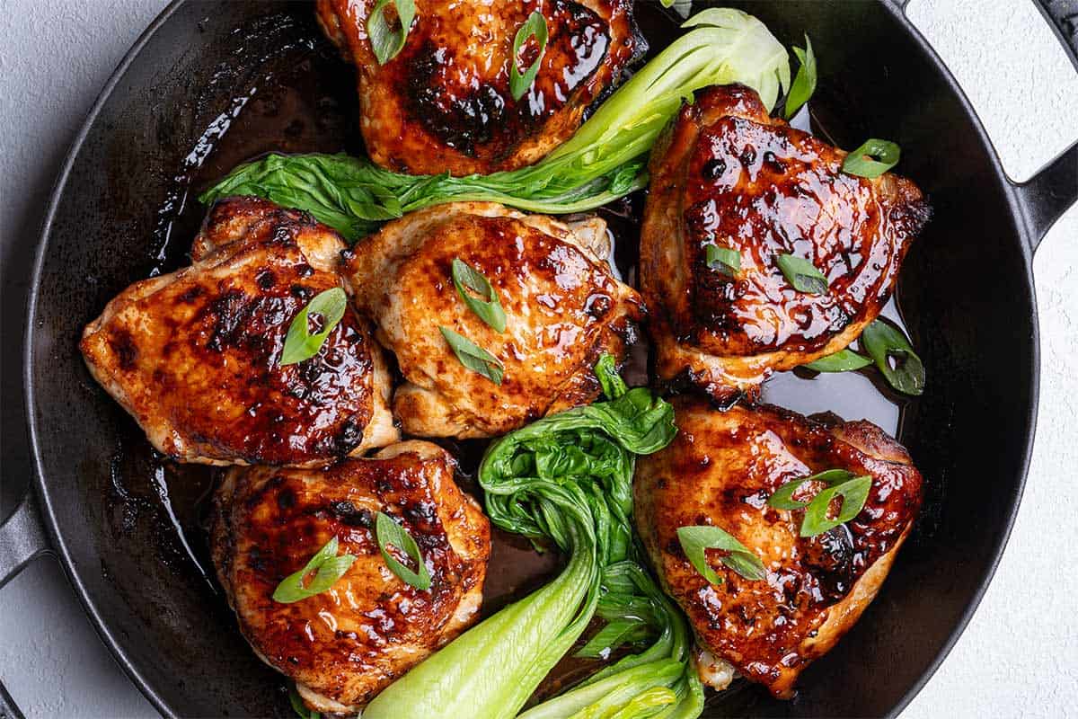 chicken in a skillet juicy and with bok choy