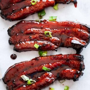 Sticky Chinese Barbecue Pork Belly pieces on a tray