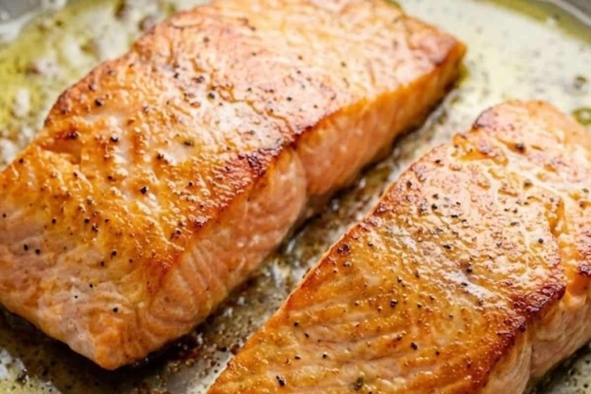 Heat olive oil in a skillet over medium heat. Cook the salmon on both sides until golden
