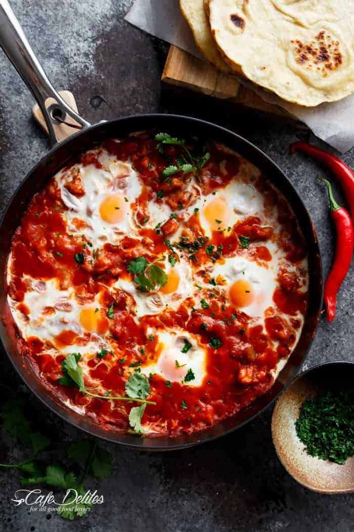 Eggs In Tomato Sauce (Shakshuka): thick, runny yolk meets rich tomato sauce in a pan