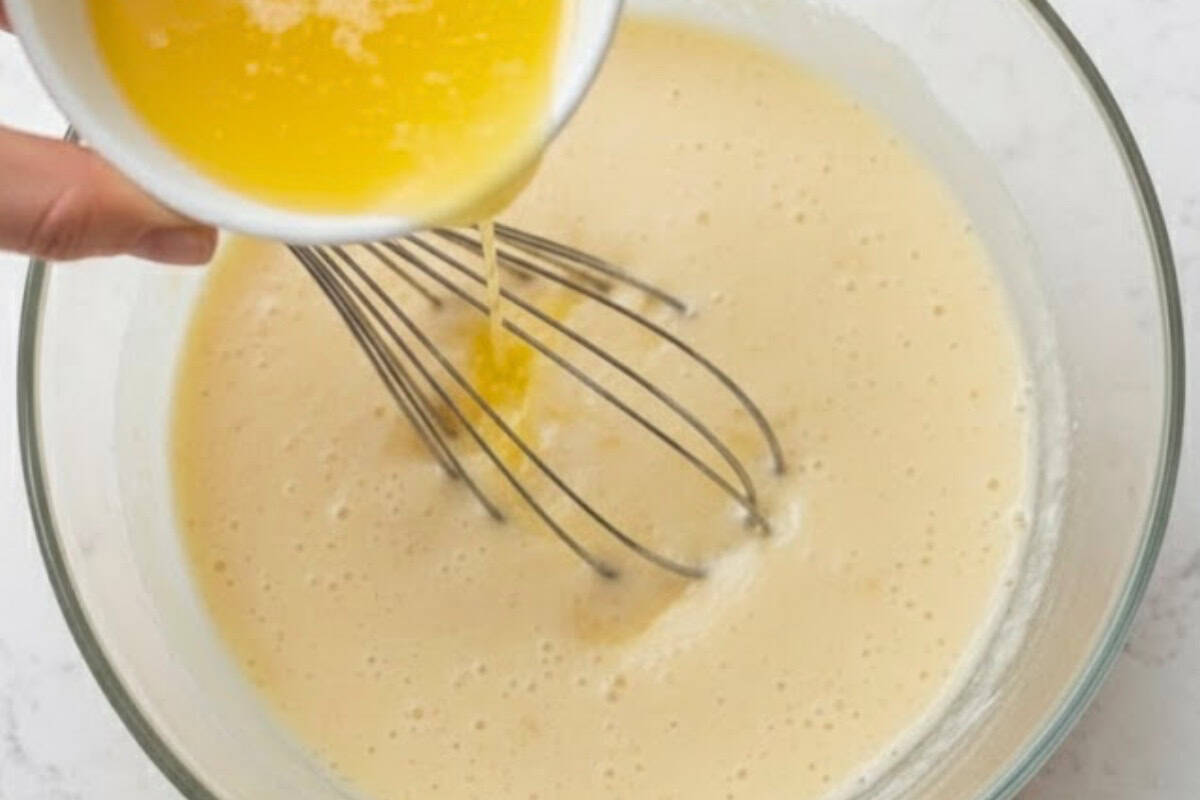 Whisk melted butter into the wet mixture, then pour into the dry ingredients