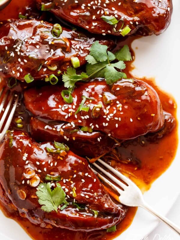 Slow Cooker Asian Glazed Chicken Breasts (or chicken thighs) for those 'throw it all in the slow cooker' days and let something else worry about your dinner! Fall apart tender chicken breast filling your house with sweet, honey garlic aromas, perfectly slow cooked and waiting for you when you get home.