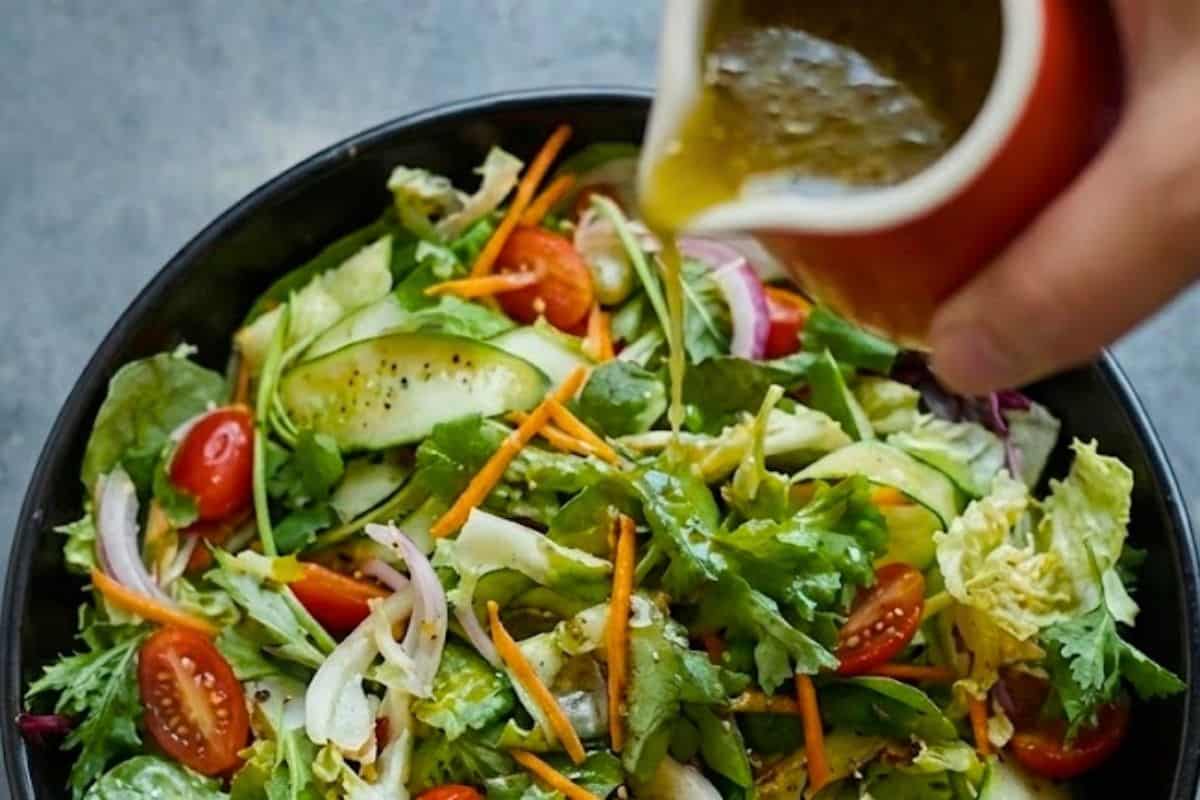 Combine all salad ingredients in a large bowl, then whisk dressing ingredients in a jug until well mixed and pour over the leaves
