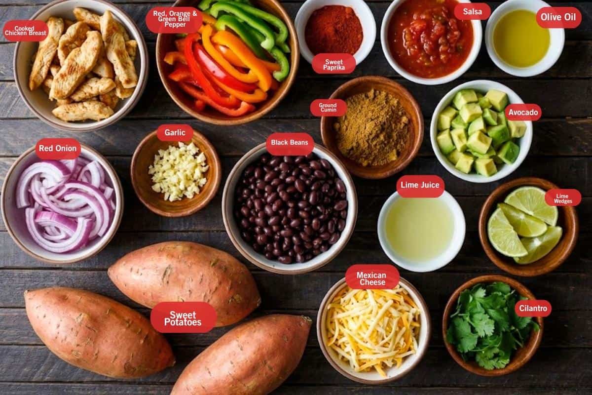 Flat lay photo of ingredient shot of
twice baked sweet potatoes fajitas
(cooked chicken breast, red, green, orange bell pepper, salsa, black beans, olive oil, avocado, lime wedges, cilantro, Mexican cheese, sweet potatoes, red onion, garlic, ground cumin, sweet paprika)