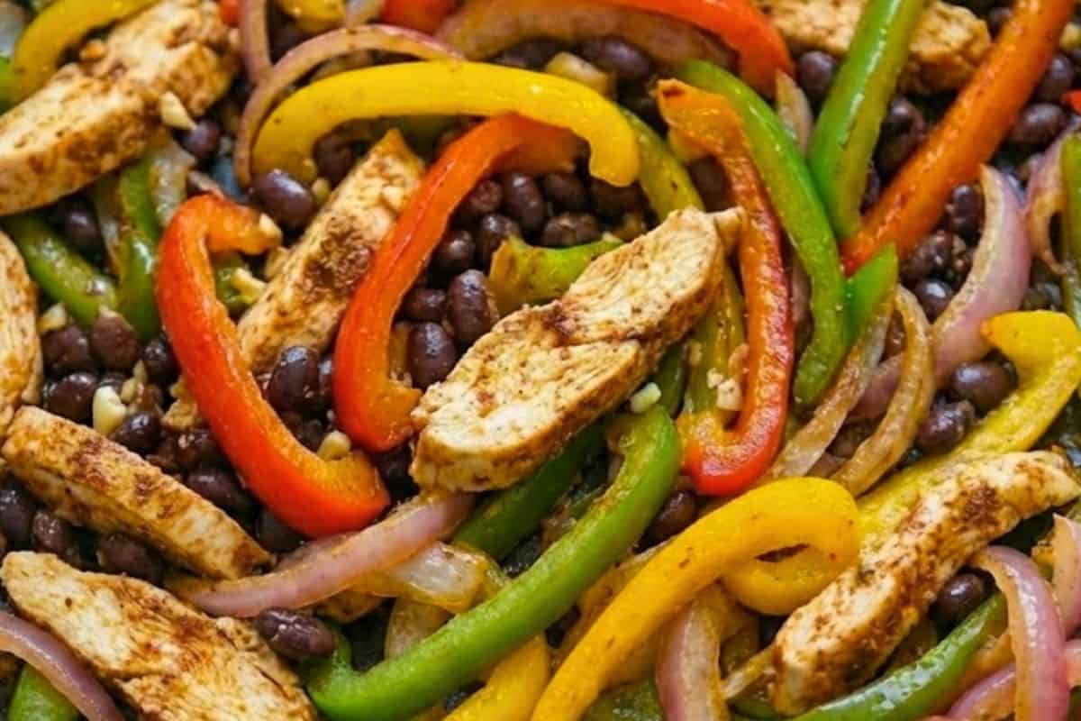 Stir in the sliced chicken breast, cumin, and paprika until everything is well coated.