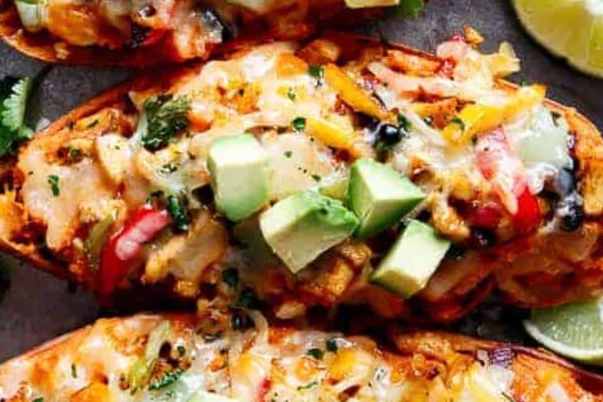 Place the potato skins back on the baking tray and fill them with the mixture. Sprinkle with shredded cheese and cilantro