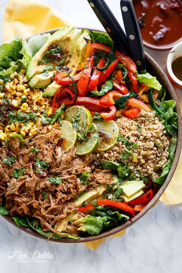 Crispy Carnitas in a salad drizzled with an incredible Chipotle Lime Dressing and a low carb Cilantro Lime Rice! in a pan